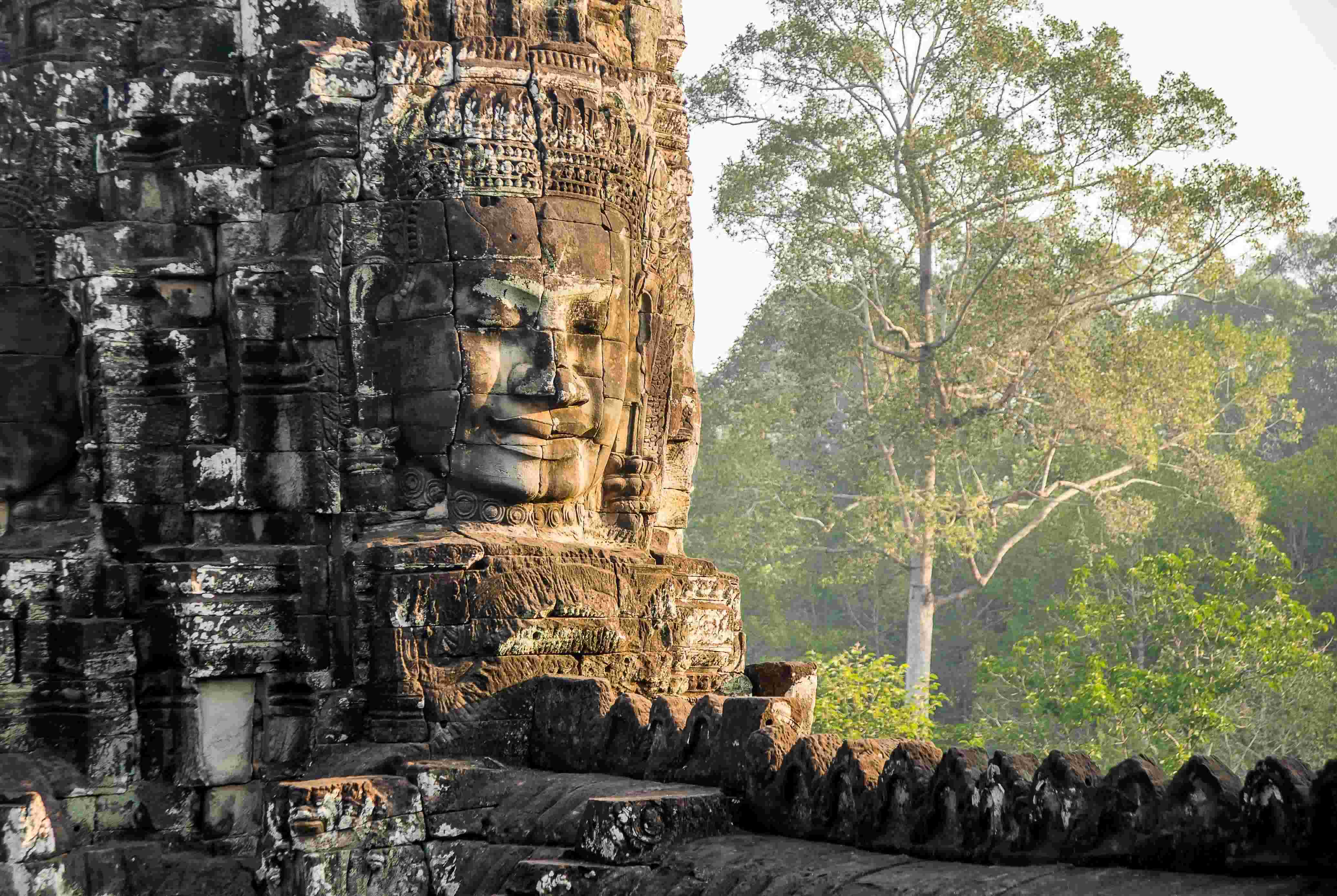 Sunrise over the iconic towers of Angkor Wat temple in Siem Reap, Cambodia.